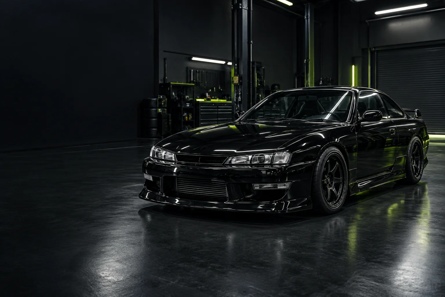 Illustrative black S-chassis project car in a workshop